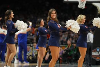 Apr 5, 2025; San Antonio, TX, USA; Auburn Tigers cheerleaders perform against the Florida Gators in the semifinals of the men's Final Four of the 2025 NCAA Tournament at the Alamodome. Mandatory Credit: Robert Deutsch-Imagn Images