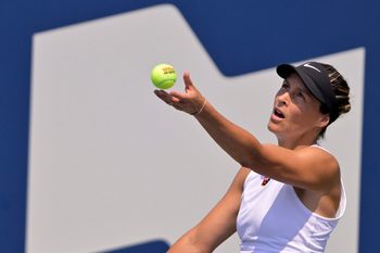 Jul 28, 2025; Montreal, QC, Canada; Tatjana Maria (GER) serves against Laura Siegemund (GER) in first round play at IGA Stadium. Mandatory Credit: Eric Bolte-Imagn Images