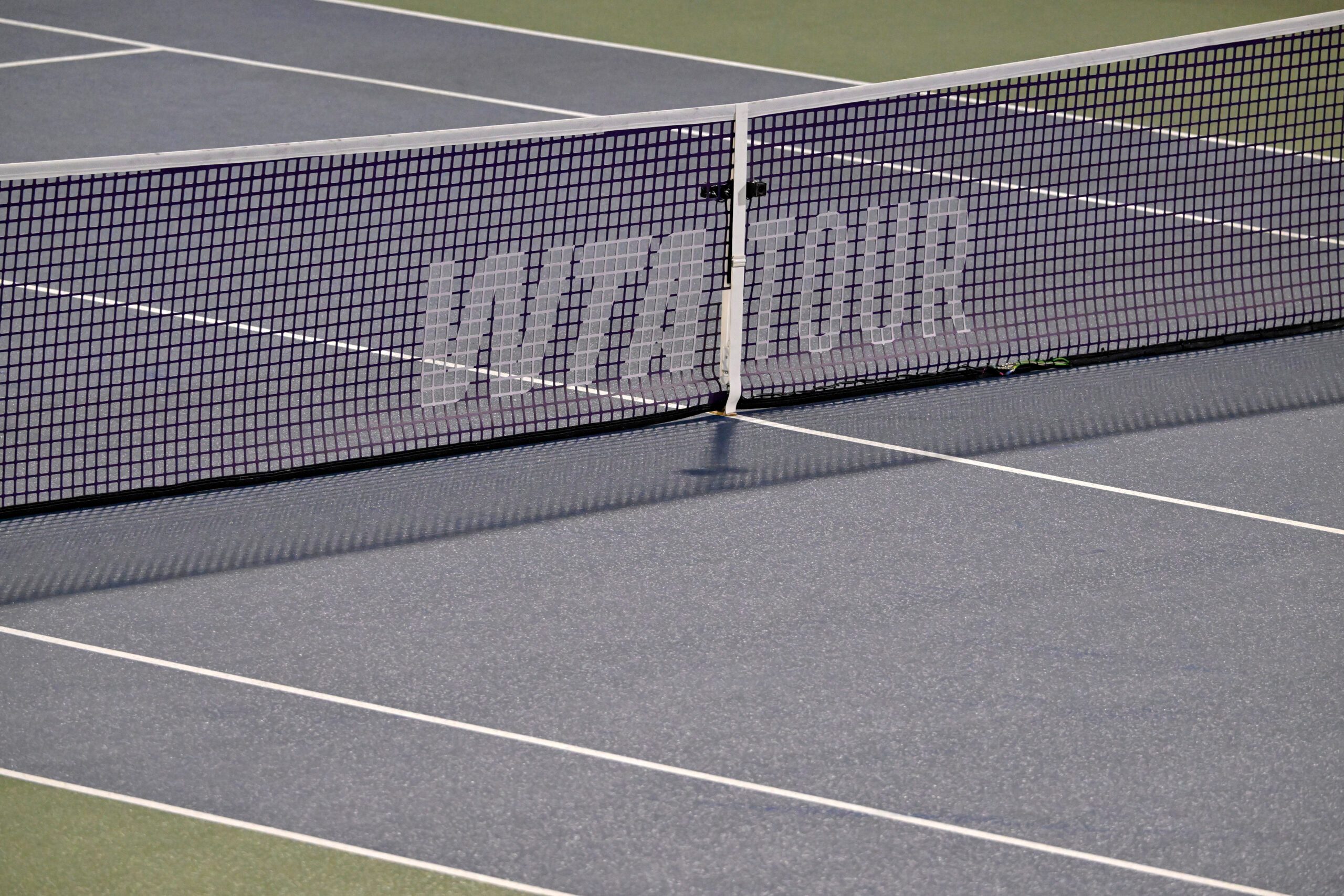 Aug 2, 2025; Montreal, QC, Canada; Rain delay on centre court and the WTA logo on the net during the match between Jessica Bouzas Maneiro (ESP) and Lin Zhu (CHN) in fourth round play at IGA Stadium. Mandatory Credit: Eric Bolte-Imagn Images