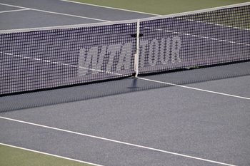 Aug 2, 2025; Montreal, QC, Canada; Rain delay on centre court and the WTA logo on the net during the match between Jessica Bouzas Maneiro (ESP) and Lin Zhu (CHN) in fourth round play at IGA Stadium. Mandatory Credit: Eric Bolte-Imagn Images