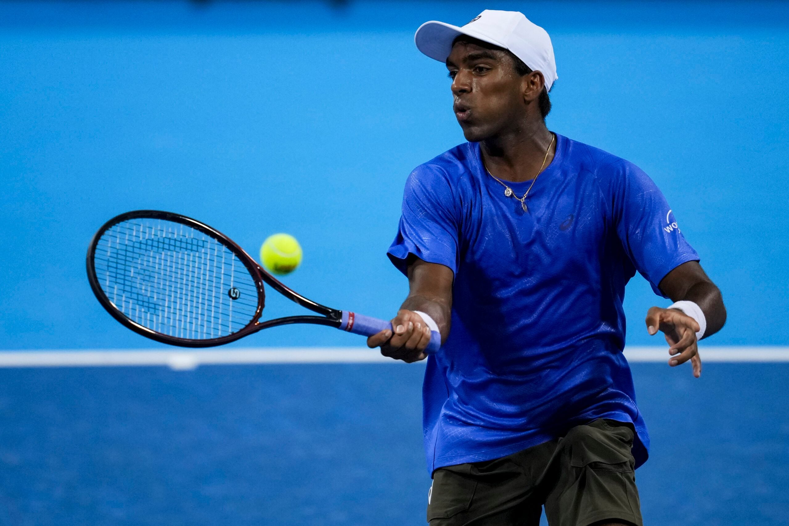 Aug 10, 2025; Cincinnati, OH, USA;  Nishesh Basavareddy (USA) returns a shot against Alexander Zverev (GER) during the Cincinnati Open at the Lindner Family Tennis Center. Mandatory Credit: Aaron Doster-Imagn Images
