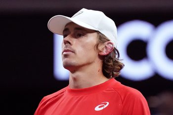 Sep 20, 2025; San Francisco, CA, USA;  Team World Player Alex de Minaur injures his ear after hitting it with his racket during a doubles match against Team Europe players Holger Rune and Casper Ruud at the Laver Cup at Chase Center. Mandatory Credit: David Gonzales-Imagn Images
