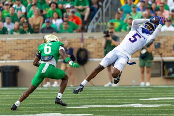 Oct 4, 2025; South Bend, Indiana, USA; Boise State Broncos wide receiver Chris Marshall (5) makes a catch that was called back due to offensive pass interference as Notre Dame Fighting Irish cornerback Christian Gray (6) defends during the second half at Notre Dame Stadium. Mandatory Credit: Michael Caterina-Imagn Images