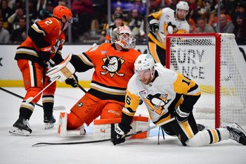 Oct 14, 2025; Anaheim, California, USA; Anaheim Ducks goaltender Lukas Dostal (1) defends the goal against Pittsburgh Penguins right wing Justin Brazeau (16) during the third period at Honda Center. Mandatory Credit: Gary A. Vasquez-Imagn Images