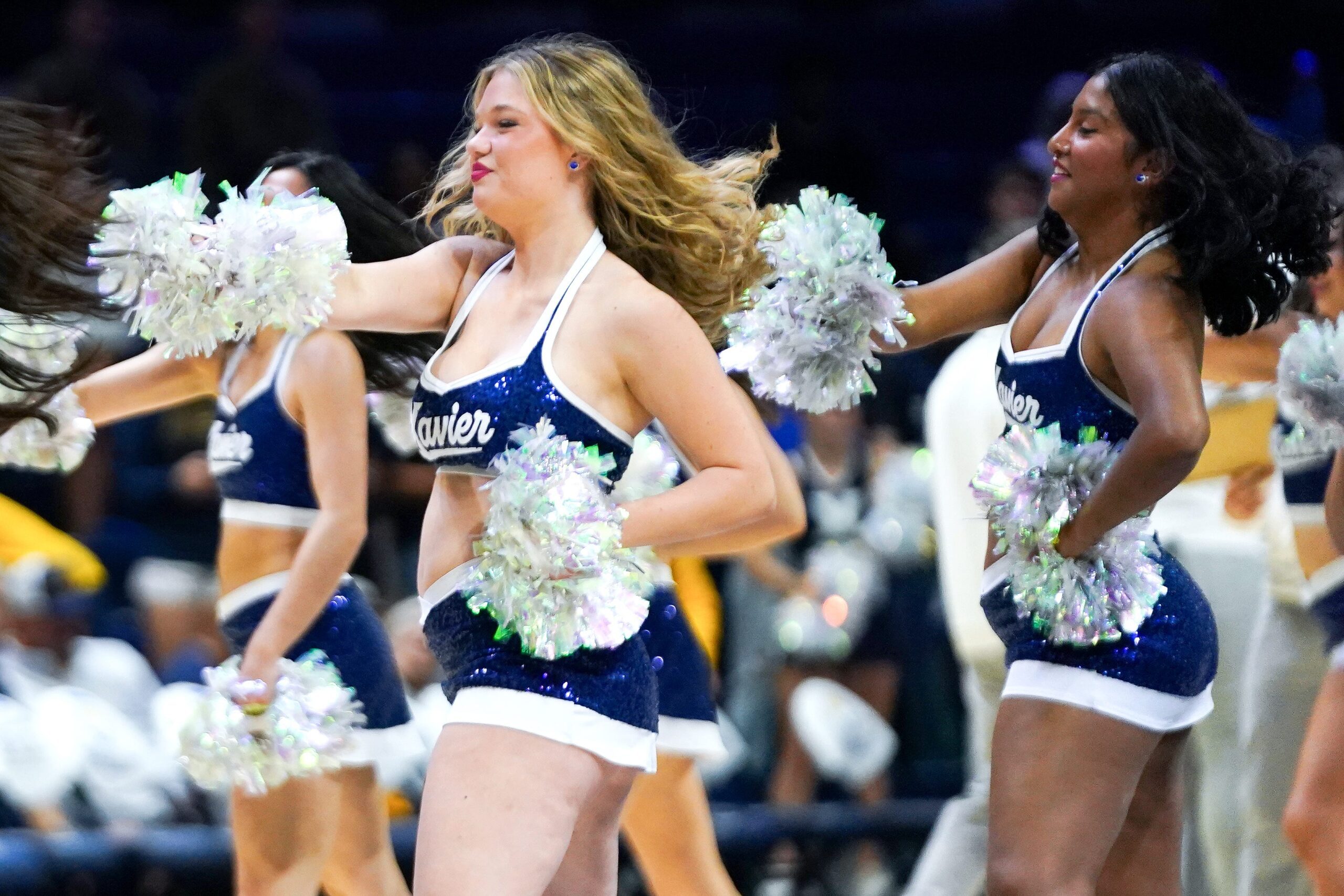 Xavier Musketeers cheerleaders perform a routine during a timeout in the second half of a NCAA men’s basketball game between the Xavier Musketeers and Murray State Racers, Saturday, Oct. 18, 2025, at Cintas Center in Cincinnati.