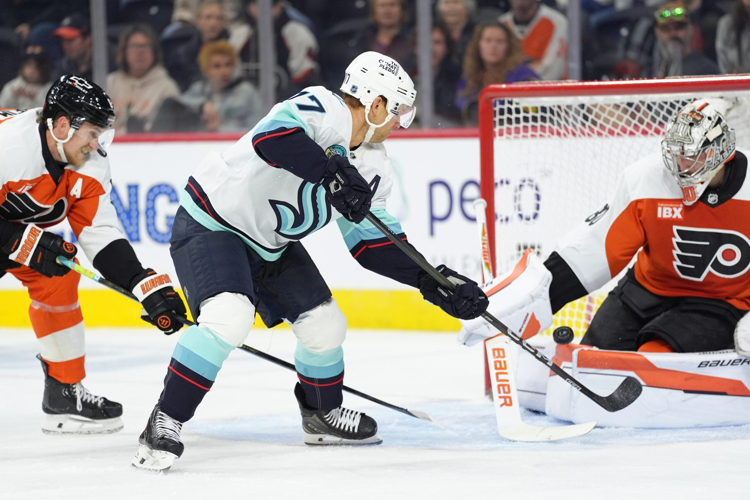 Oct 20, 2025; Philadelphia, Pennsylvania, USA; Seattle Kraken left wing Jaden Schwartz (17) deflects the puck against the Philadelphia Flyers in the first period at Xfinity Mobile Arena. Mandatory Credit: Kyle Ross-Imagn Images