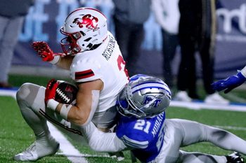 Jacksonville State wide receiver Brock Rechsteiner (3) carries the ball as Middle Tennessee cornerback Abdul Muhammad (21) makes the stop during the football game, at MTSU on Wednesday, October 29, 2025.