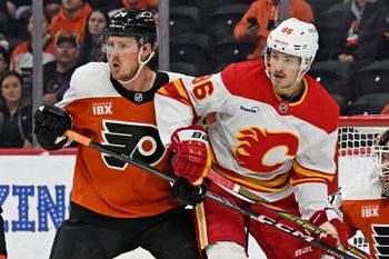 Nov 2, 2025; Philadelphia, Pennsylvania, USA; Philadelphia Flyers defenseman Nick Seeler (24) battles for position with Calgary Flames left wing Joel Farabee (86) during the first period at Xfinity Mobile Arena. Mandatory Credit: Eric Hartline-Imagn Images