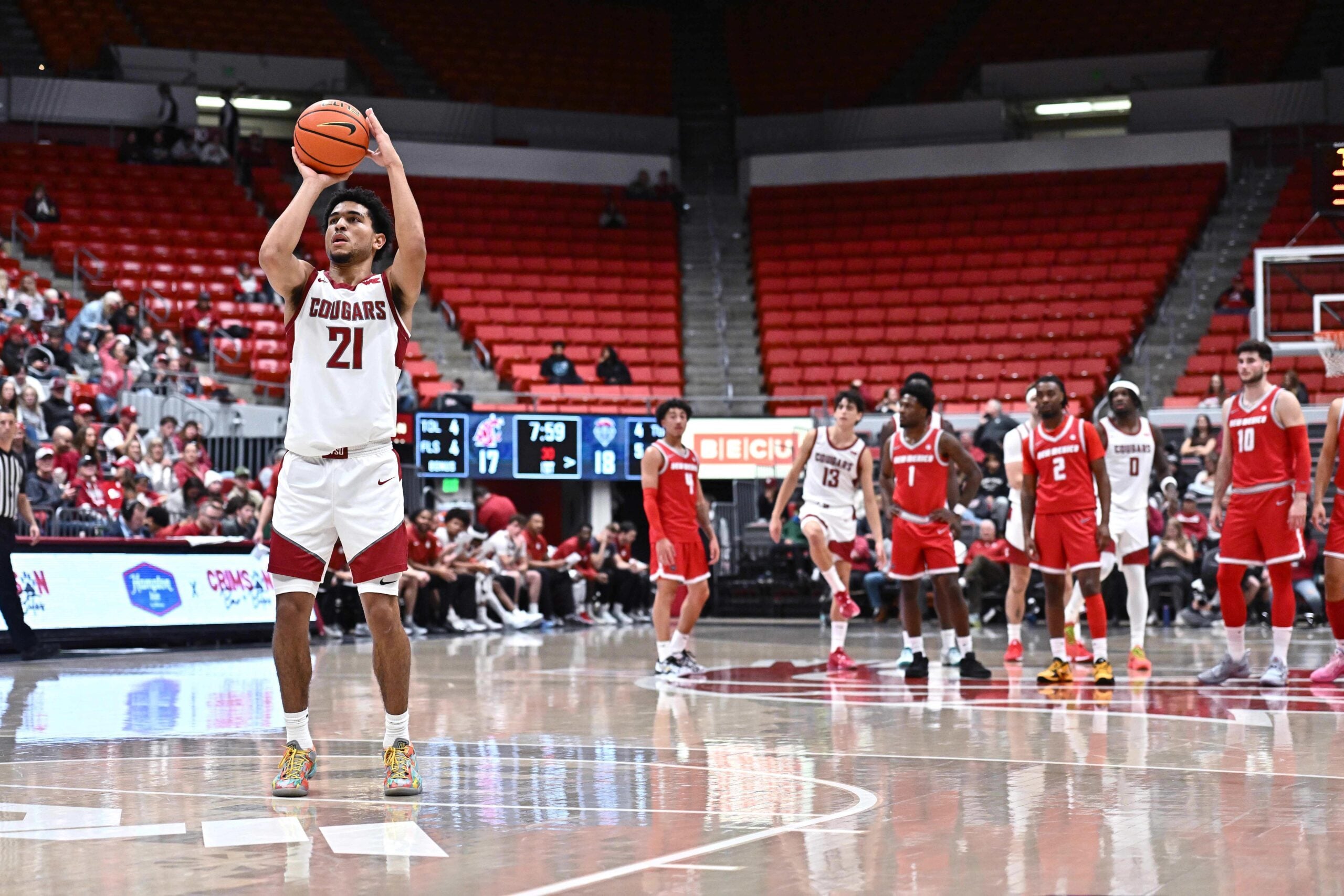 Oct 25, 2025; Pullman, WA, USA; Washington State Cougars guard Ace Glass Lll (21) shoots a technical foul against the New Mexico Lobos in the first half at Friel Court at Beasley Coliseum. Mandatory Credit: James Snook-Imagn Images