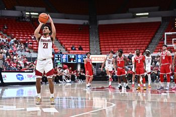 Oct 25, 2025; Pullman, WA, USA; Washington State Cougars guard Ace Glass Lll (21) shoots a technical foul against the New Mexico Lobos in the first half at Friel Court at Beasley Coliseum. Mandatory Credit: James Snook-Imagn Images