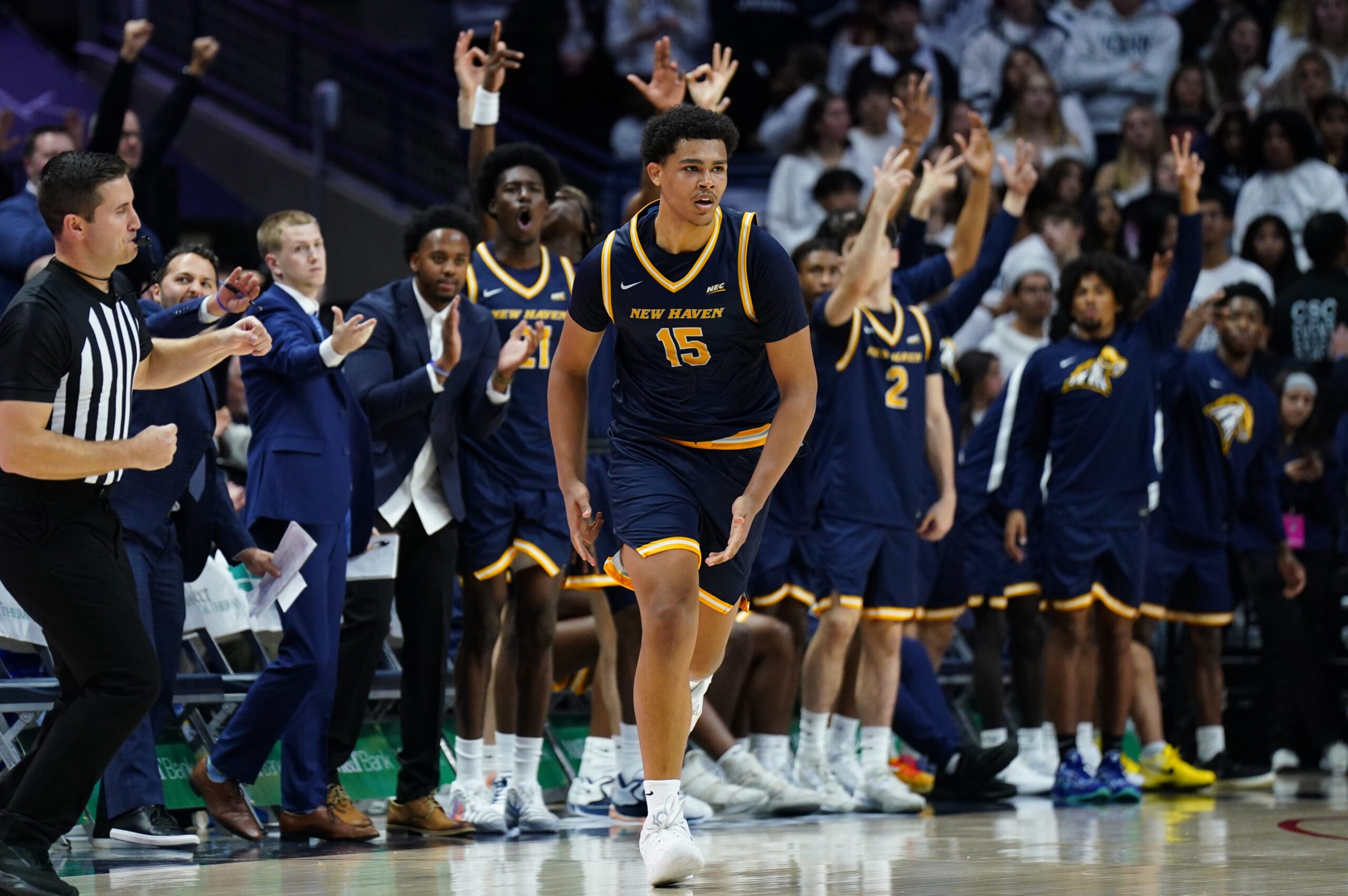 Nov 3, 2025; Storrs, Connecticut, USA; New Haven Chargers forward Andre Pasha (15) and his teammates react after his three point basket against the UConn Huskies in the second half at Harry A. Gampel Pavilion. Mandatory Credit: David Butler II-Imagn Images
