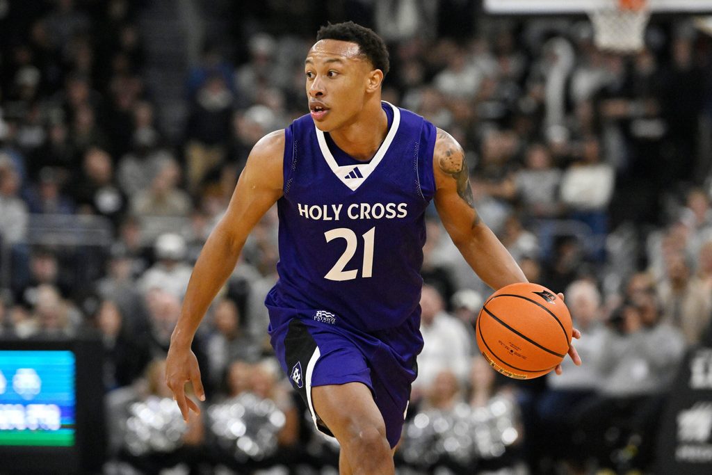 Nov 3, 2025; Providence, Rhode Island, USA; Holy Cross Crusaders guard Gabe Warren (21) dribbles the ball during the second half against the Providence Friars at Amica Mutual Pavilion. Mandatory Credit: Eric Canha-Imagn Images
