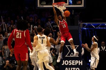 Marist Red Foxes guard Elijah Lewis (13) dunks as Marist Red Foxes guard Jadin Collins-Roberts (0) looks on in the second half of the basketball game at the Cintas Center on Nov. 3, 2025.