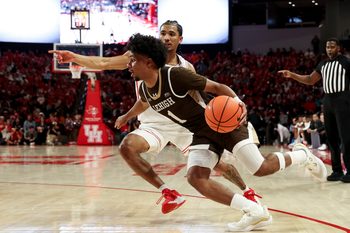 Nov 3, 2025; Houston, Texas, USA; Lehigh Mountain Hawks guard Nasir Whitlock (1) drives as Houston Cougars guard Milos Uzan (7) defends during the second half at Fertitta Center. Mandatory Credit: Maria Lysaker-Imagn Images