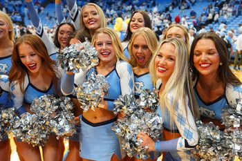 Nov 7, 2025; Chapel Hill, North Carolina, USA; North Carolina Tar Heels cheerleaders celebrate after the game at Dean E. Smith Center. Mandatory Credit: Bob Donnan-Imagn Images