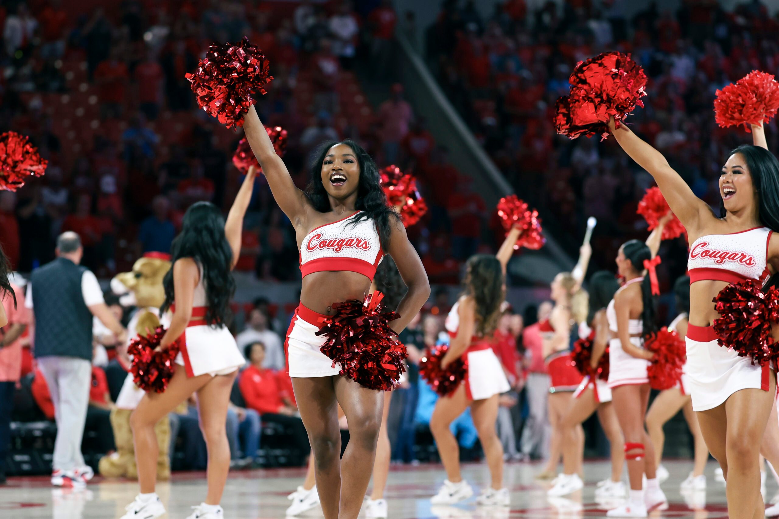 Nov 8, 2025; Houston, Texas, USA; Houston Cougars cheerleaders perform before the game against the Towson Tigers at Fertitta Center. Mandatory Credit: Troy Taormina-Imagn Images