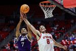 Nov 8, 2025; Salt Lake City, Utah, USA; Weber State Wildcats center Malek Gomma (7) and Utah Utes forward Keanu Dawes (8) battle for a rebound during the second half at Jon M. Huntsman Center. Mandatory Credit: Rob Gray-Imagn Images