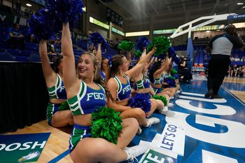 Cheerleader wav to the crowd. The Florida Gulf Coast University women's basketball team opened their season Saturday, Nov. 8, as the lady Eagles faced off against Davidson College Wildcats at Alico Arena. Davidson walked away with the victory with a final score of 77-51.