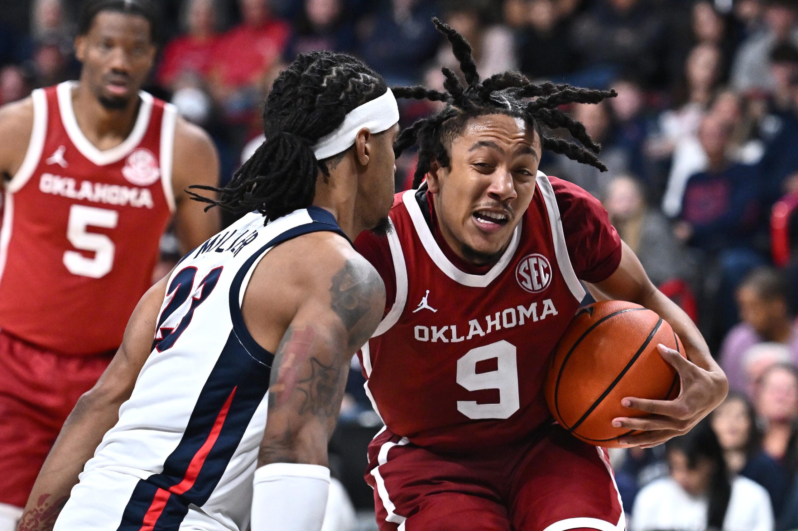 Nov 8, 2025; Spokane, Washington, USA; Oklahoma Sooners guard Nijel Pack (9) runs the lane against Gonzaga Bulldogs guard Adam Miller (23) in the second half at Numerica Veterans Arena. Gonzaga Bulldogs won 83-68. Mandatory Credit: James Snook-Imagn Images