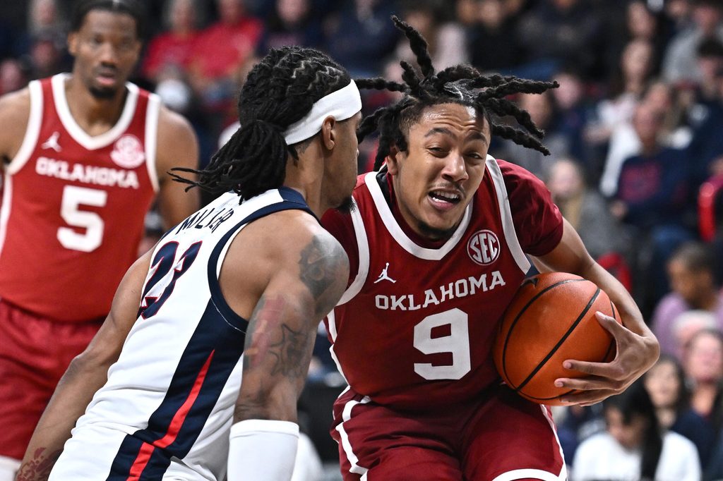 Nov 8, 2025; Spokane, Washington, USA; Oklahoma Sooners guard Nijel Pack (9) runs the lane against Gonzaga Bulldogs guard Adam Miller (23) in the second half at Numerica Veterans Arena. Gonzaga Bulldogs won 83-68. Mandatory Credit: James Snook-Imagn Images
