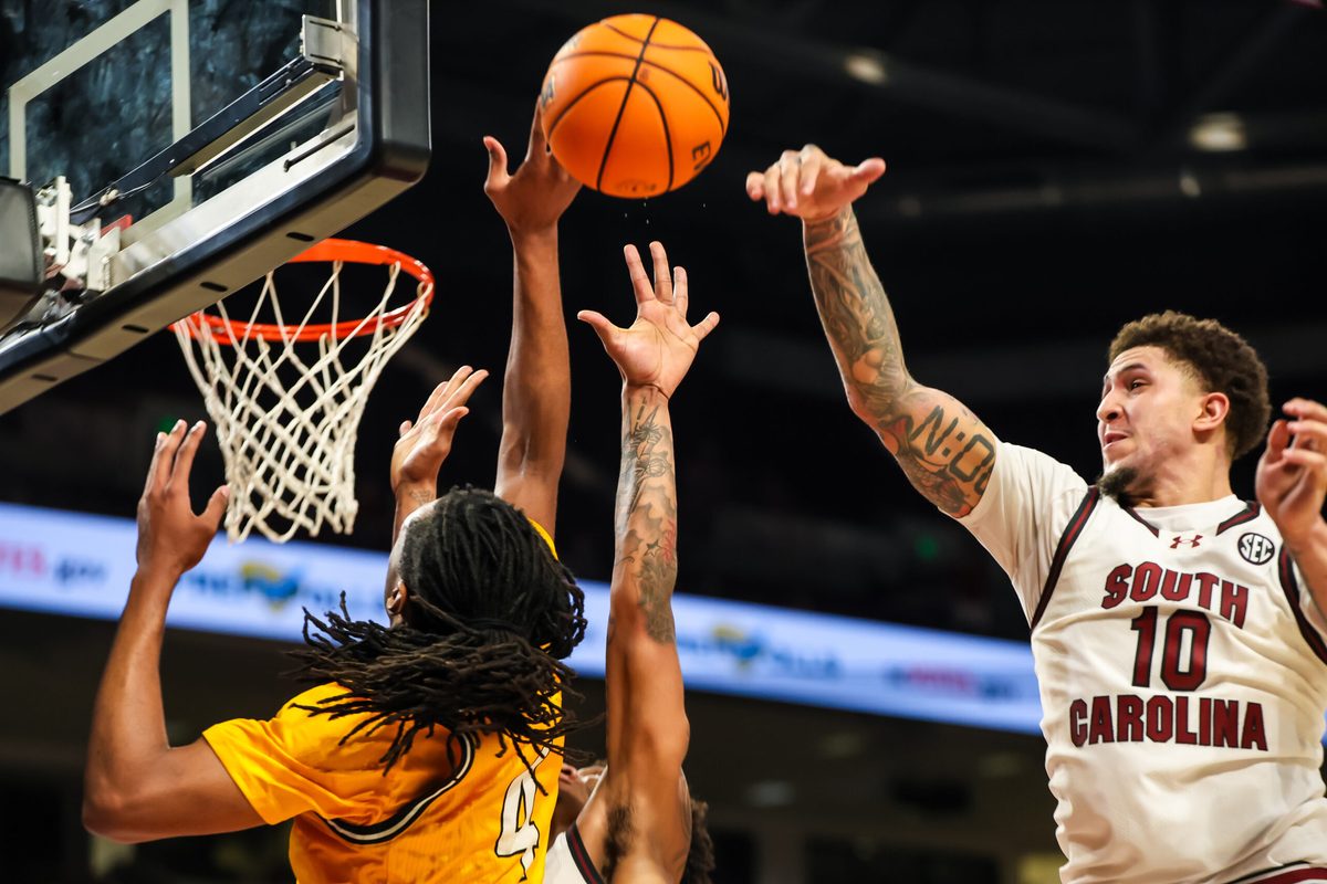 Nov 9, 2025; Columbia, South Carolina, USA; South Carolina Gamecocks forward Myles Stute (10) blocks the shot of Southern Mississippi Golden Eagles forward Tylik Weeks (4) in the second half at Colonial Life Arena. Mandatory Credit: Jeff Blake-Imagn Images