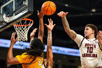 Nov 9, 2025; Columbia, South Carolina, USA; South Carolina Gamecocks forward Myles Stute (10) blocks the shot of Southern Mississippi Golden Eagles forward Tylik Weeks (4) in the second half at Colonial Life Arena. Mandatory Credit: Jeff Blake-Imagn Images