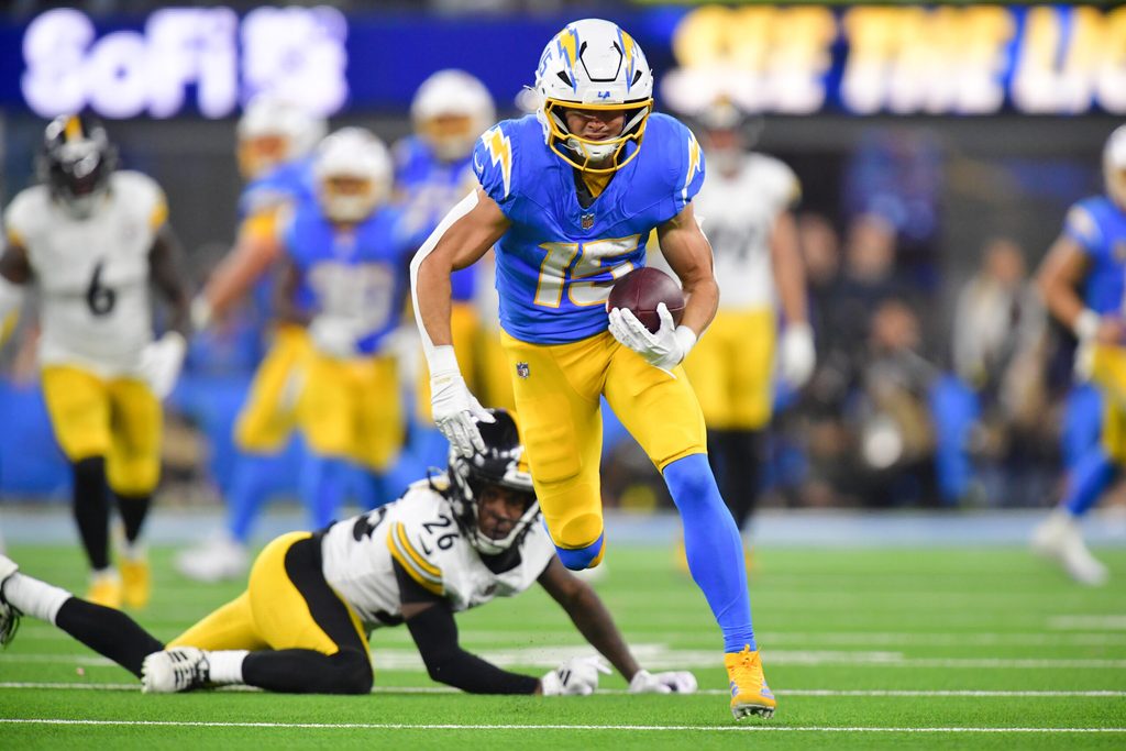 Nov 9, 2025; Inglewood, California, USA; Los Angeles Chargers wide receiver Ladd McConkey (15) carries the ball after a reception against the Pittsburgh Steelers during the fourth quarter of the game at SoFi Stadium. Mandatory Credit: Gary A. Vasquez-Imagn Images