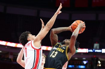 Nov 11, 2025; Columbus, Ohio, USA; Appalachian State Mountaineers guard Kasen Jennings (13) takes a shot against Ohio State Buckeyes guard John Mobley Jr. (0) during the first half at Value City Arena. Mandatory Credit: Joseph Maiorana-Imagn Images
