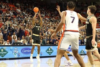 Nov 11, 2025; Auburn, Alabama, USA;  Wofford Terriers guard Kahmare Holmes (11) takes a 3-point shot during the first half against the Auburn Tigers at Neville Arena. Mandatory Credit: John Reed-Imagn Images