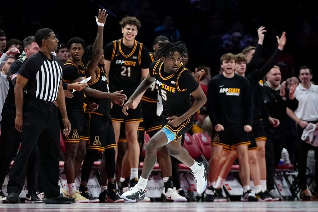 The Appalachian State Mountaineers bench reacts to a shot by guard Jason Clarke Jr. (5) during the NCAA men's basketball game against the Ohio State Buckeyes at Value City Arena in Columbus on Nov. 11, 2025. Ohio State won 75-53.