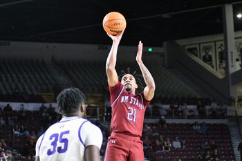 Jemel Jones takes a wide open shot as the Aggies took on the Cowboys of NM Highlands on Tuesday night at the Pan American Center.