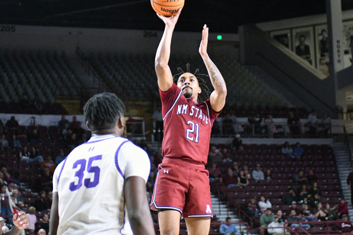 Jemel Jones takes a wide open shot as the Aggies took on the Cowboys of NM Highlands on Tuesday night at the Pan American Center.
