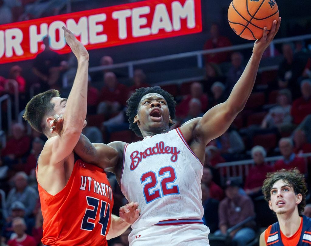 Bradley’s Jaquan Johnson makes a move to the basket on UT-Martin’s Vladimir Khryapa in the second half of their non-conference basketball game Wednesday, Nov. 12, 2025 at Carver Arena in Peoria.
