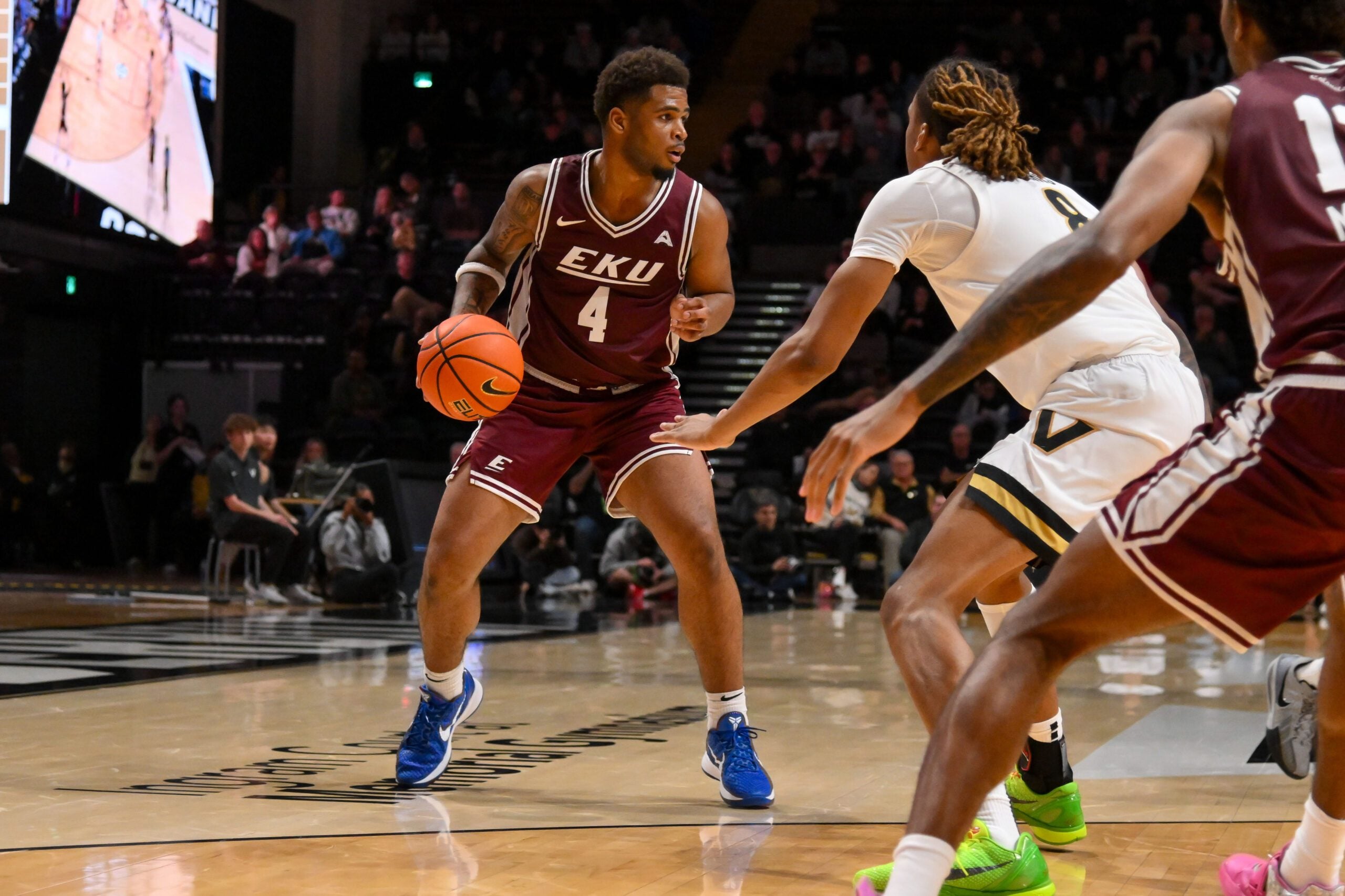 Nov 12, 2025; Nashville, Tennessee, USA;  Eastern Kentucky Colonels guard Jr. Juan Cranford (4) drives to the basket against the Vanderbilt Commodores during the second half at Memorial Gymnasium. Mandatory Credit: Steve Roberts-Imagn Images