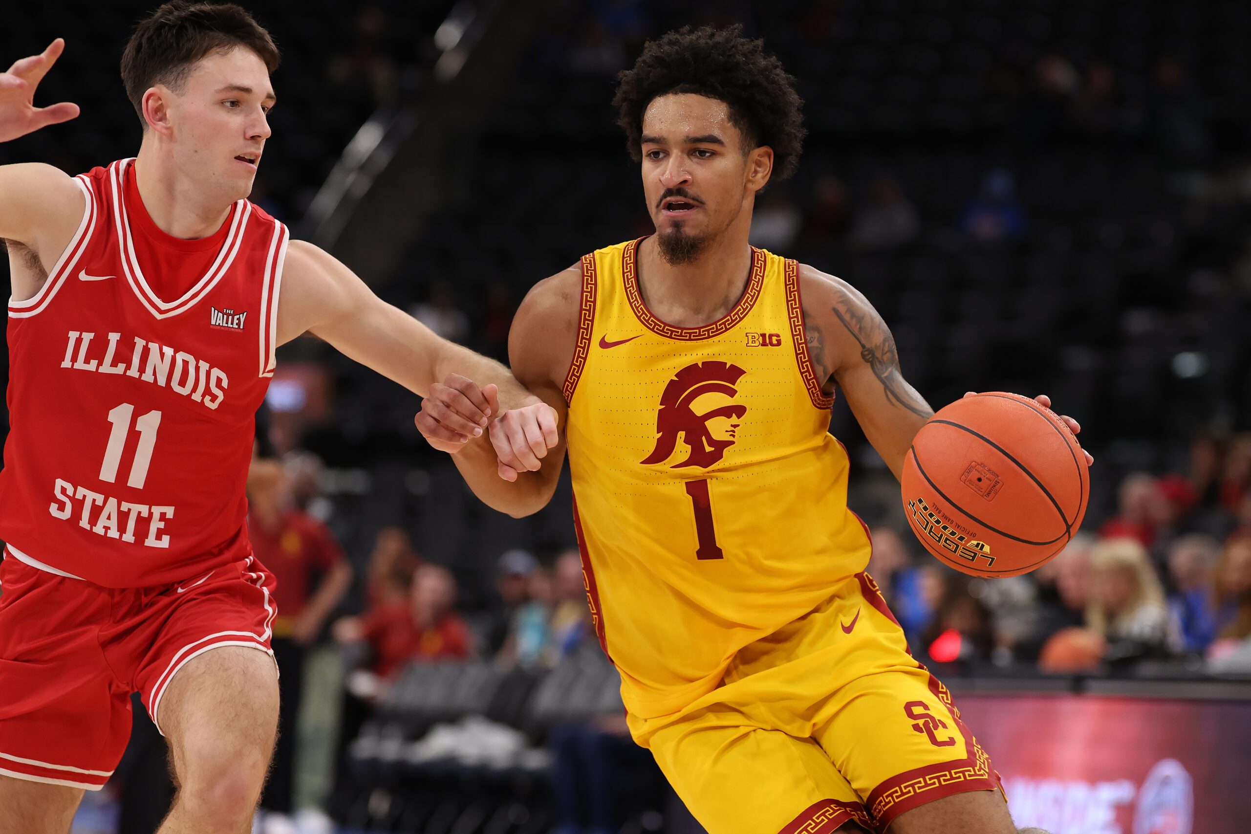 Nov 14, 2025; Inglewood, California, USA;  Southern California Trojans guard Rodney Rice (1) dribbles the ball against Illinois State Redbirds guard Johnny Kinziger (11) during the first half of the Hall of Fame Series game at Intuit Dome. Mandatory Credit: Kiyoshi Mio-Imagn Images