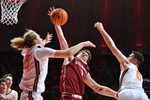 Nov 14, 2025; Champaign, Illinois, USA;  Colgate Raiders guard Brady Cummins (1) tries to pull down a rebound between Illinois Fighting Illini forward Jake Davis (15) and  David Mirkovic (0)during the first half at State Farm Center. Mandatory Credit: Ron Johnson-Imagn Images