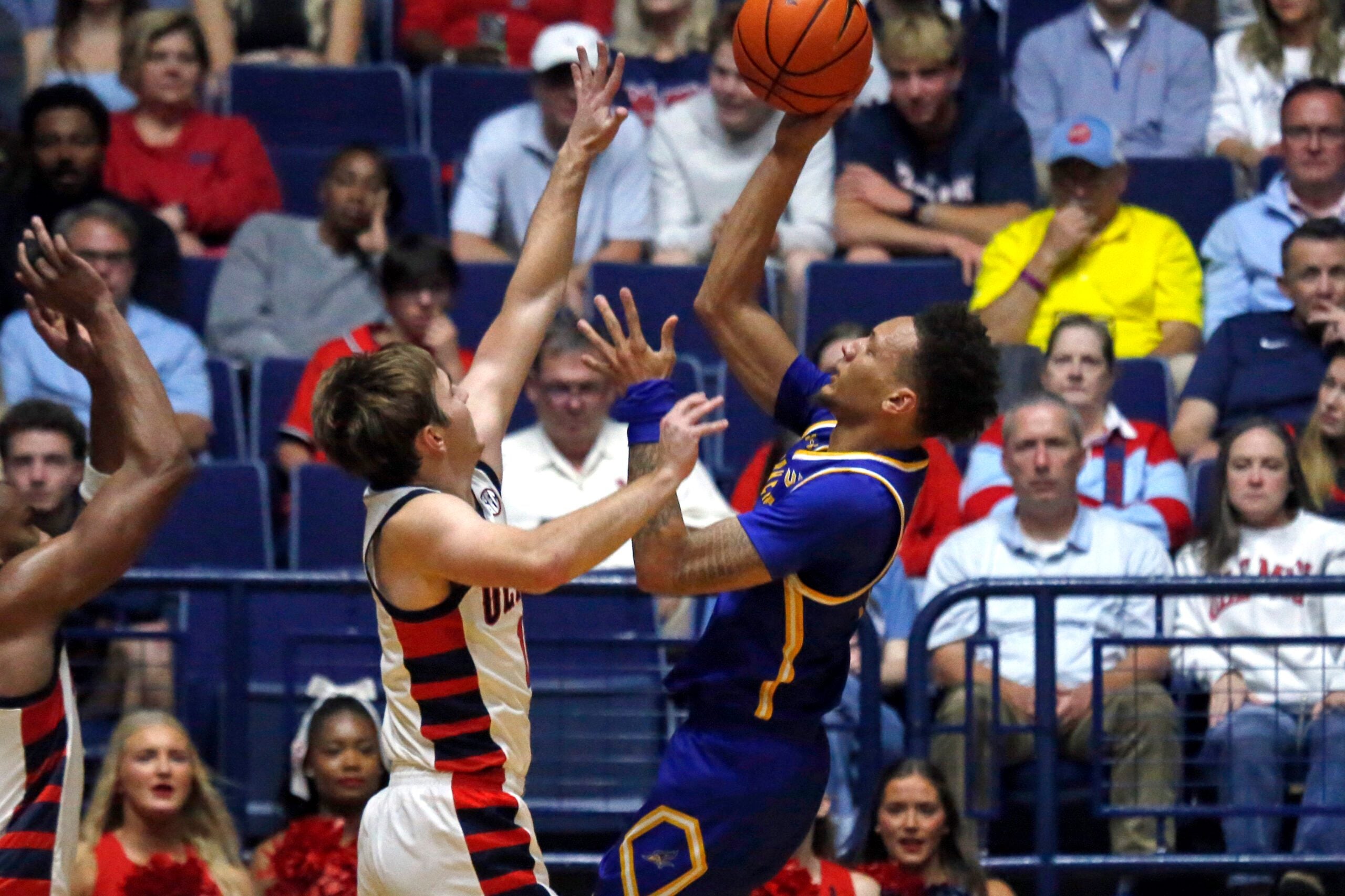 Nov 14, 2025; Oxford, Mississippi, USA; Cal State Bakersfield Roadrunners guard Dailin Smith (15) shoots as Mississippi Rebels guard Travis Perry (11) defends during the first half at C.M. ’Tad’ Smith Coliseum. Mandatory Credit: Petre Thomas-Imagn Images