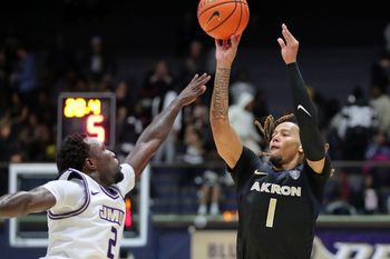 Akron Zips guard Shammah Scott shoots a 3-pointer over James Madison guard Bradley Douglas on Nov. 3, 2025.