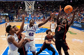 Nov 15, 2025; Lawrence, Kansas, USA; Princeton Tigers forward Malik Abdullahi (7) grabs a rebound during the second half against the Kansas Jayhawks at Allen Fieldhouse. Mandatory Credit: Jay Biggerstaff-Imagn Images