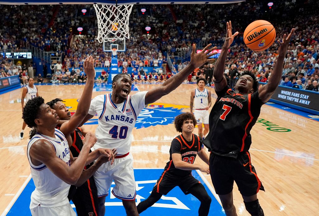 Nov 15, 2025; Lawrence, Kansas, USA; Princeton Tigers forward Malik Abdullahi (7) grabs a rebound during the second half against the Kansas Jayhawks at Allen Fieldhouse. Mandatory Credit: Jay Biggerstaff-Imagn Images