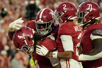 Nov 15, 2025; Tuscaloosa, Alabama, USA;  Alabama Crimson Tide running back Daniel Hill (4) celebrates his touchdown run against the Oklahoma Sooners with offensive lineman Kadyn Proctor (74), wide receiver Ryan Williams (2) and offensive lineman Kam Dewberry (71) at Saban Field at Bryant-Denny Stadium. Oklahoma defeated Alabama 23-21. Mandatory Credit: Gary Cosby Jr.-Imagn Images