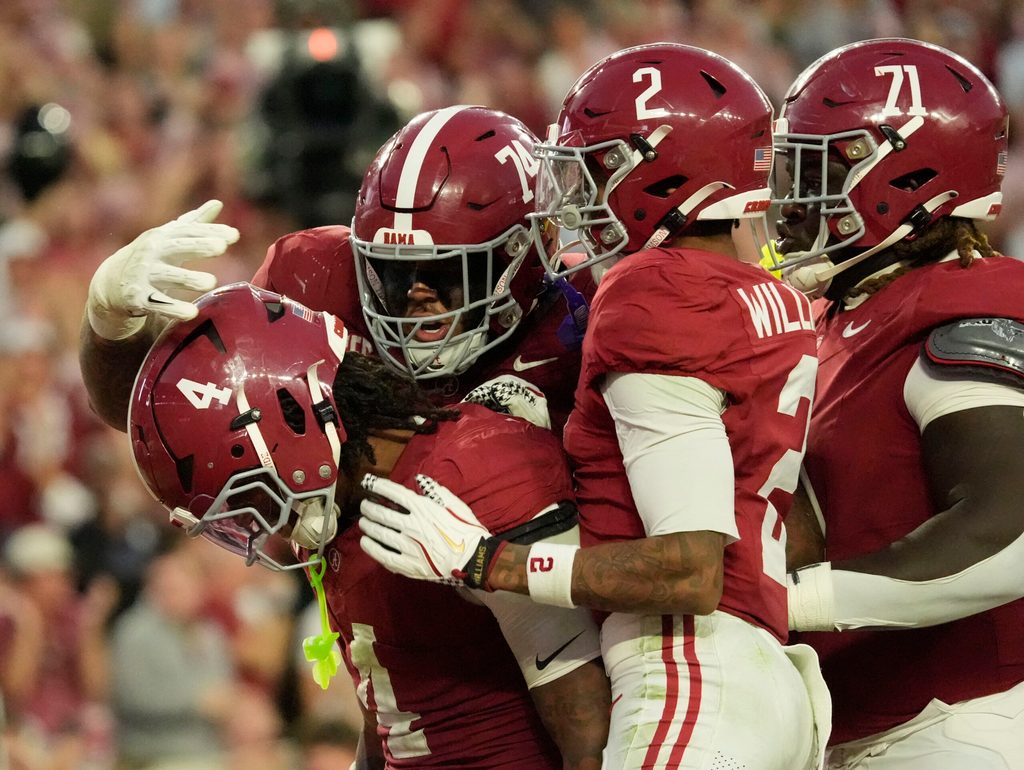 Nov 15, 2025; Tuscaloosa, Alabama, USA; Alabama Crimson Tide running back Daniel Hill (4) celebrates his touchdown run against the Oklahoma Sooners with offensive lineman Kadyn Proctor (74), wide receiver Ryan Williams (2) and offensive lineman Kam Dewberry (71) at Saban Field at Bryant-Denny Stadium. Oklahoma defeated Alabama 23-21. Mandatory Credit: Gary Cosby Jr.-Imagn Images