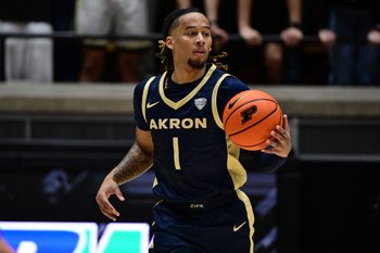 Nov 16, 2025; West Lafayette, Indiana, USA; Akron Zips guard Shammah Scott (1) dribbles down court during the first half against the Purdue Boilermakers at Mackey Arena. Mandatory Credit: Marc Lebryk-Imagn Images