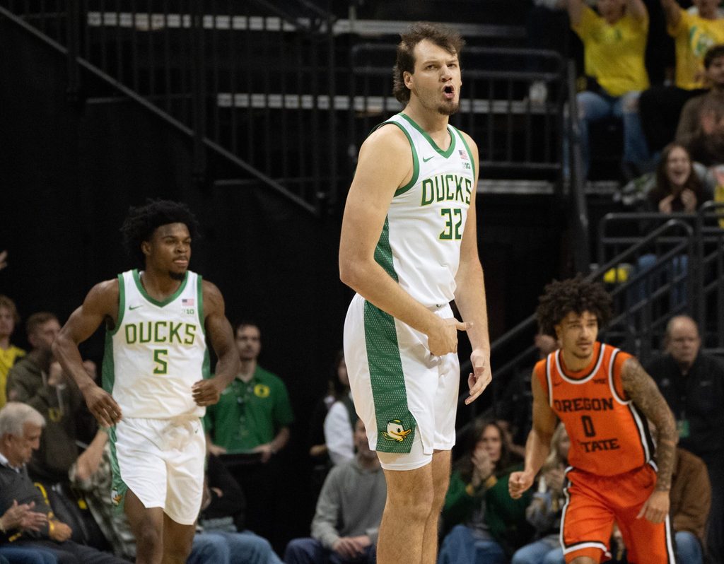 Oregon’s Nate Bittle celebrates a 3-point shot against Oregon State during the first half at Matthew Knight Arena in Eugene Nov. 17, 2025.