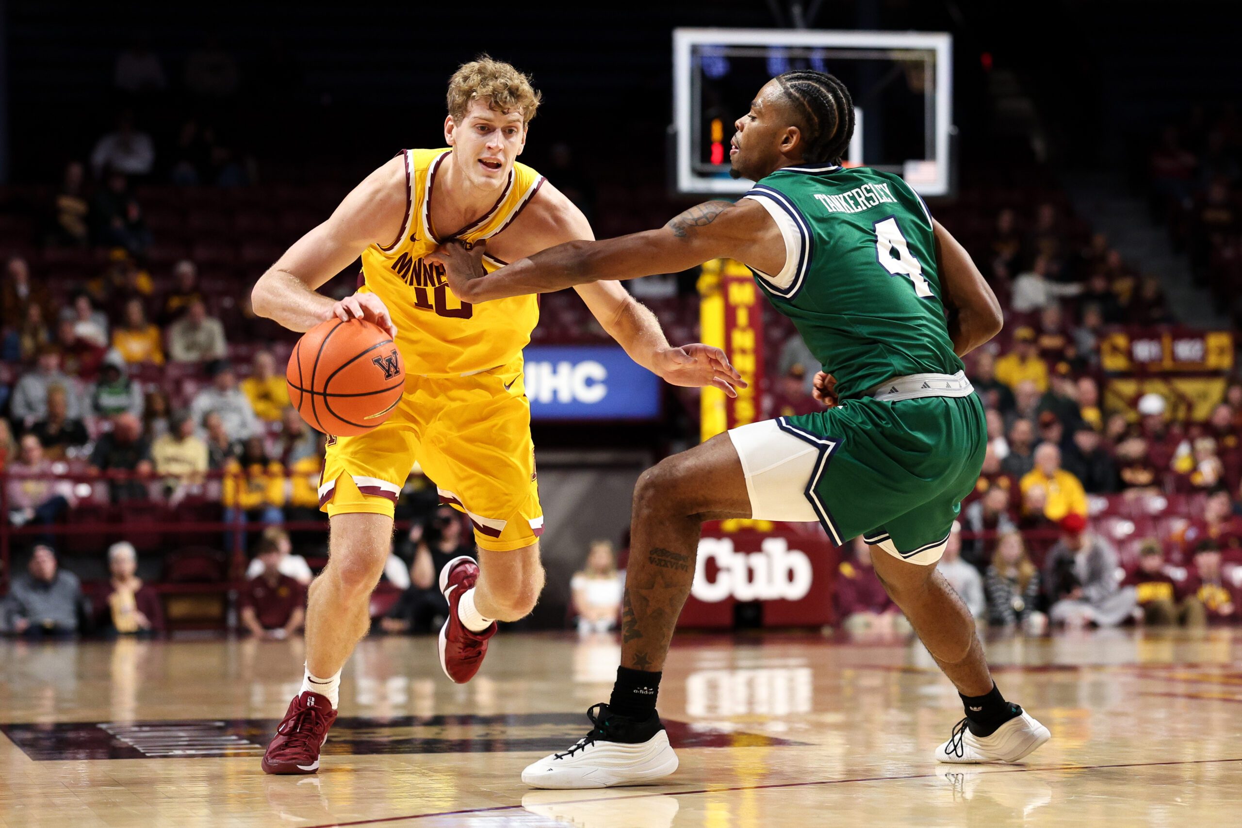 Nov 18, 2025; Minneapolis, Minnesota, USA; Minnesota Golden Gophers forward Cade Tyson (10) works around Chicago State Cougars guard Marcus Tankersley (4) during the first half at Williams Arena. Mandatory Credit: Matt Krohn-Imagn Images