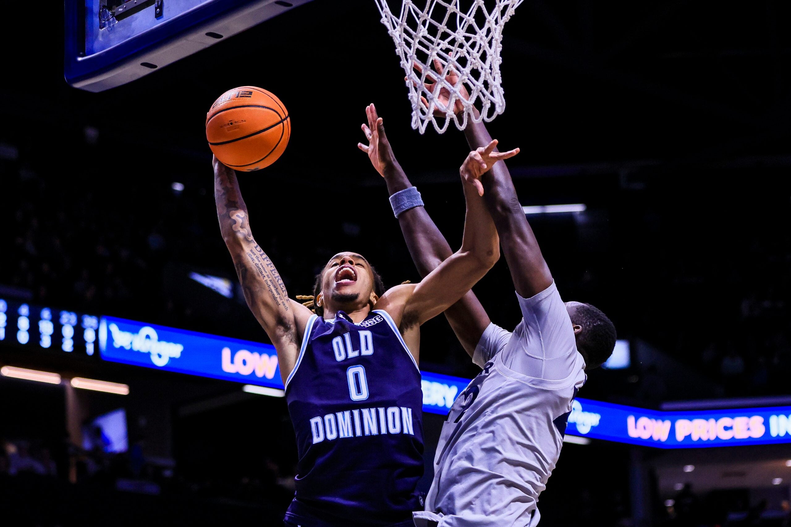 Nov 18, 2025; Cincinnati, Ohio, USA; Old Dominion Monarchs guard KC Shaw (0) shoots against Xavier Musketeers forward Pape N'Diaye (22) in the second half at Cintas Center. Mandatory Credit: Katie Stratman-Imagn Images