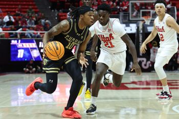 Nov 18, 2025; Salt Lake City, Utah, USA; Purdue Fort Wayne Mastodons guard Corey Hadnot II (10) drives against Utah Utes guard Obomate Abbey (21) during the first half at Jon M. Huntsman Center. Mandatory Credit: Rob Gray-Imagn Images