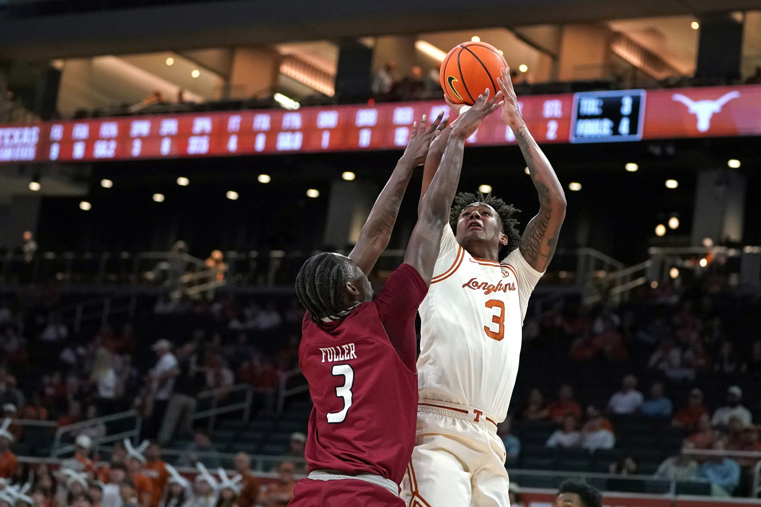 Nov 18, 2025; Austin, Texas, USA; Texas Longhorns guard Dailyn Swain (3) shoots against Rider Broncs forward Shemani Fuller (3) during the first half at Moody Center. Mandatory Credit: Dustin Safranek-Imagn Images