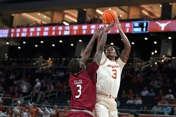 Nov 18, 2025; Austin, Texas, USA; Texas Longhorns guard Dailyn Swain (3) shoots against Rider Broncs forward Shemani Fuller (3) during the first half at Moody Center. Mandatory Credit: Dustin Safranek-Imagn Images