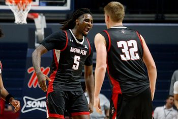 Nov 18, 2025; Oxford, Mississippi, USA; Austin Peay Governors forward Rashaud Marshall (5) reacts with forward Collin Parker (32) after a dunk during the second half against the Mississippi Rebels at The Sandy and John Black Pavilion at Ole Miss. Mandatory Credit: Petre Thomas-Imagn Images